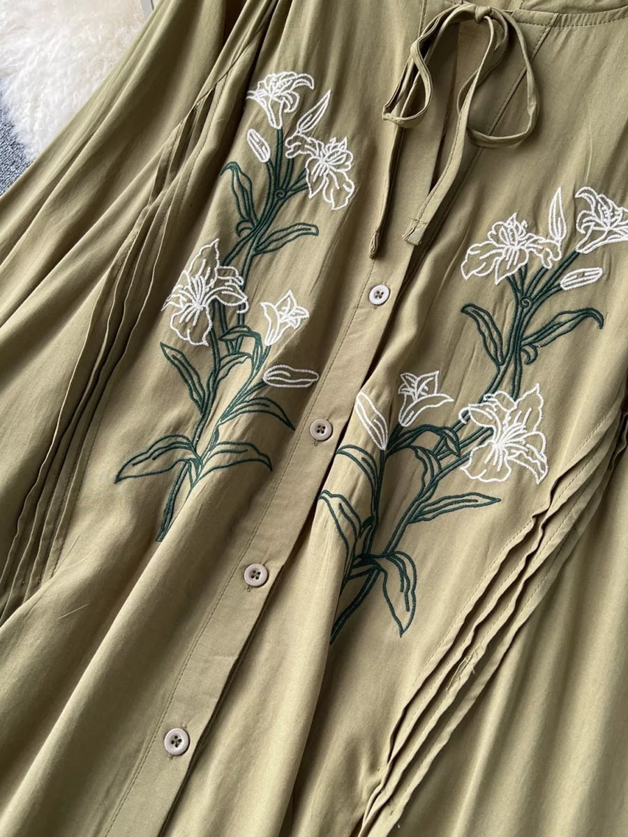 Khaki cotton maxi dress with embroidered white lilies and tie neck.