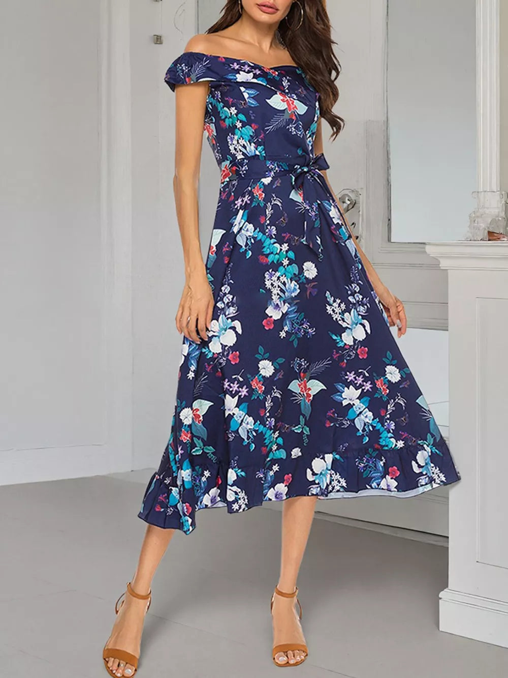 Floral off-shoulder midi dress with self-tie waist and ruffled hem.