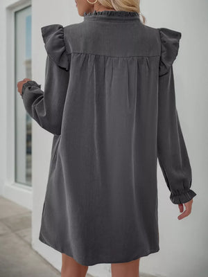 Dark gray ruffled notched sleeve dress with ruffled cuffs and neckline.