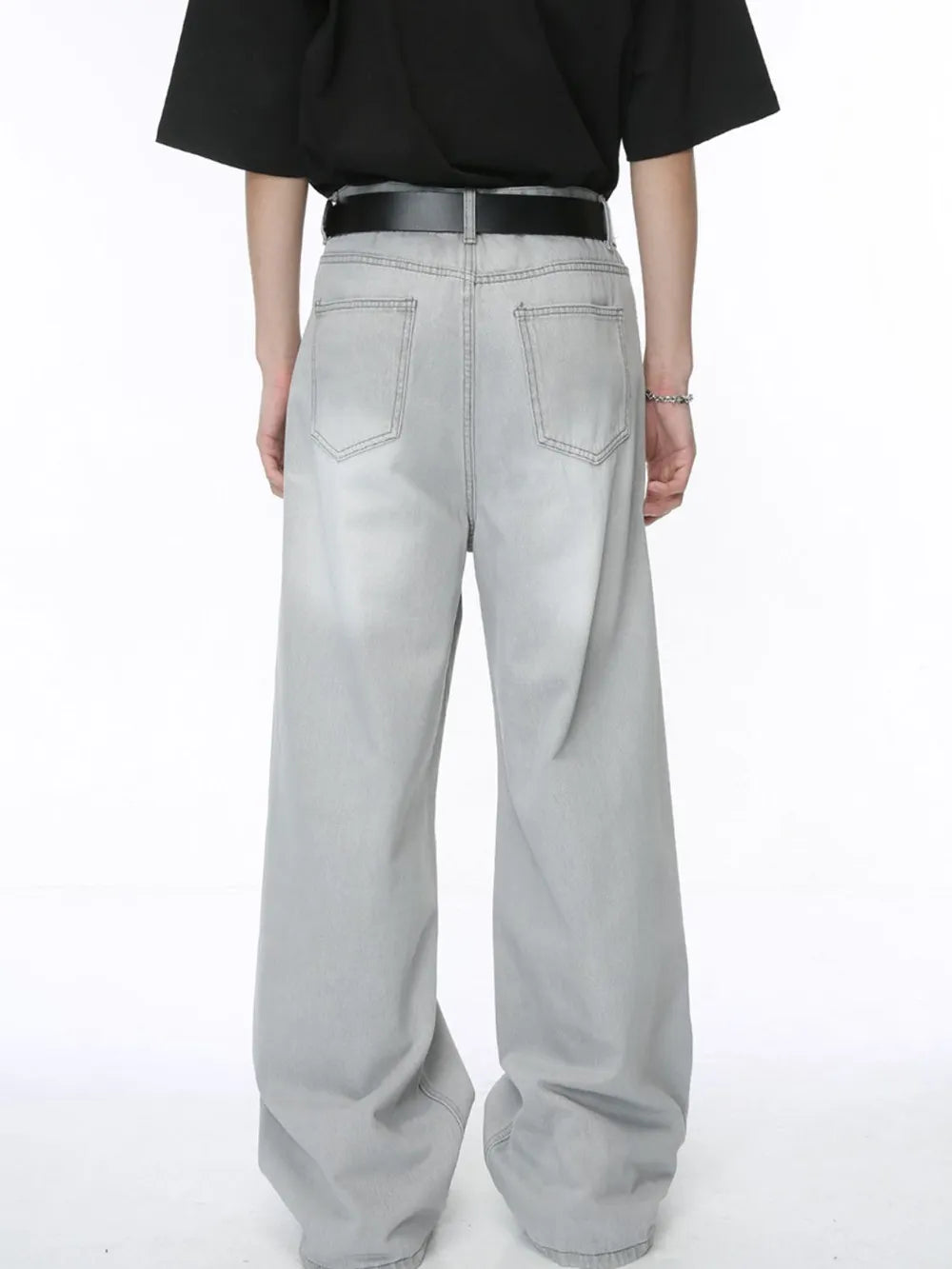 Light wash straight leg denim jeans with whiskered details and a relaxed fit.