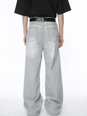 Light wash straight leg denim jeans with whiskered details and a relaxed fit.