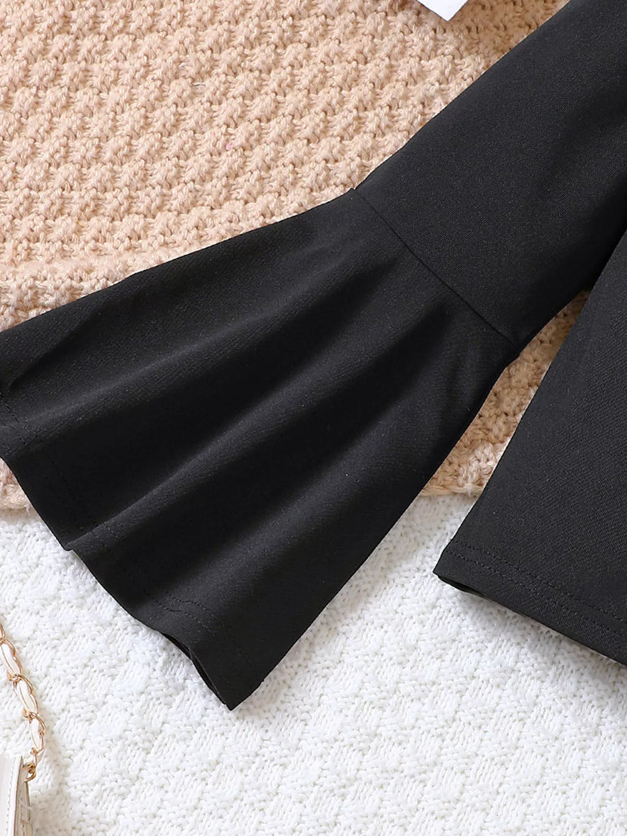 Black flared sleeve top detail