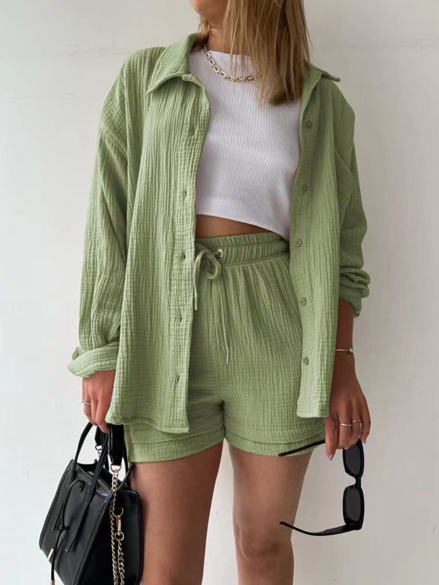 Sage green textured gauze shirt and shorts set with drawstring shorts and button-up shirt.