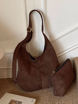 Large brown suede hobo shoulder bag with adjustable strap and matching pouch.