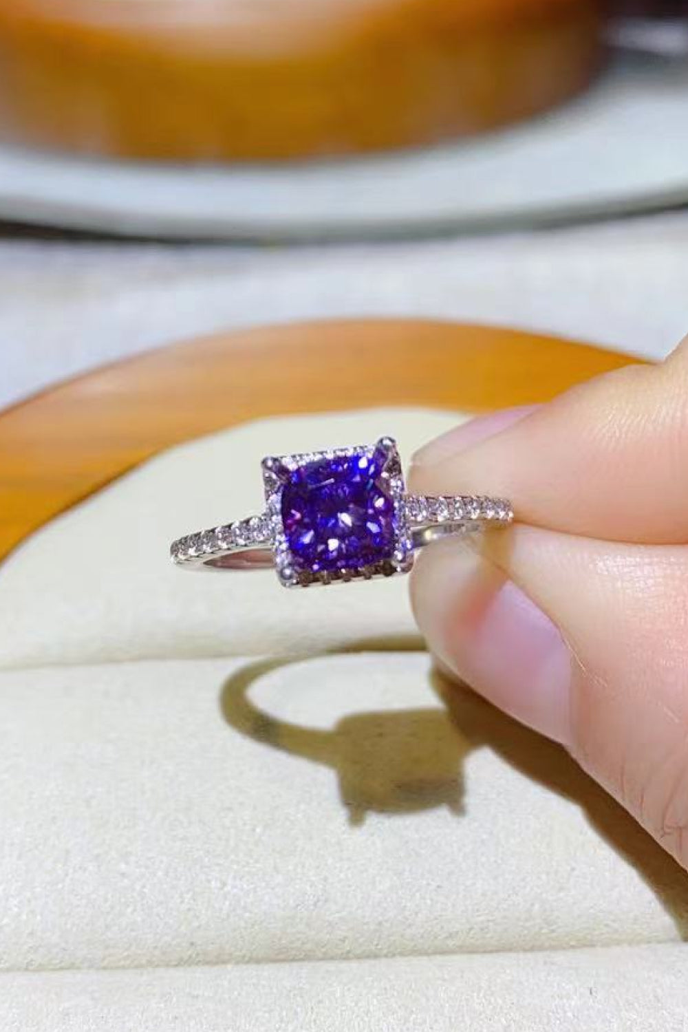 Purple cushion-cut moissanite halo ring with diamond band