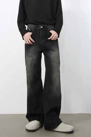 Faded wash wide leg denim jeans in dark with a distressed look.