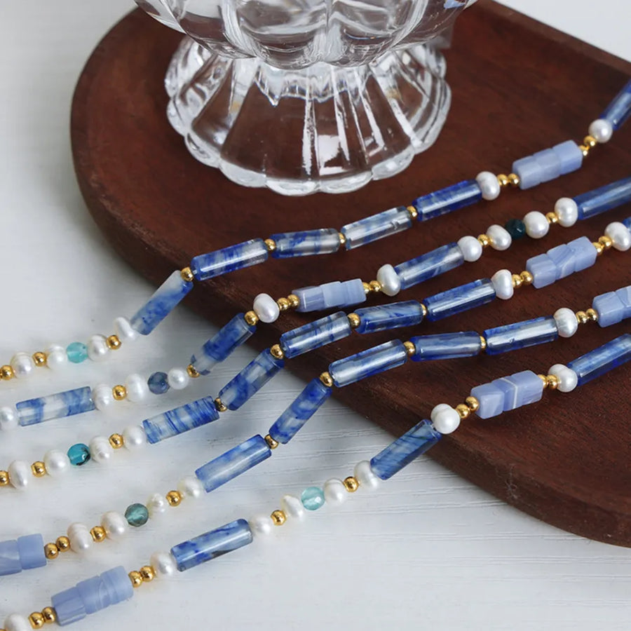 Lapis lazuli & pearl bead necklace with gold accents, light blue.