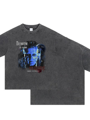 Dark gray relaxed fit tee with Hellraiser graphic print and distressed details.
