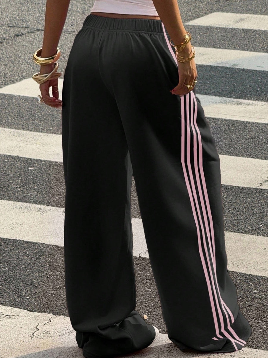 track pants featuring striped in Yellow with 100% polyester Care instructions: Machine wash cold texture