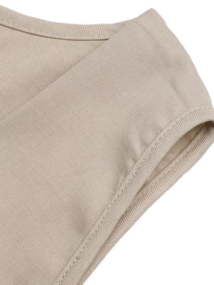 Beige sleeveless wrap top detail in polyester fabric with clean stitching.