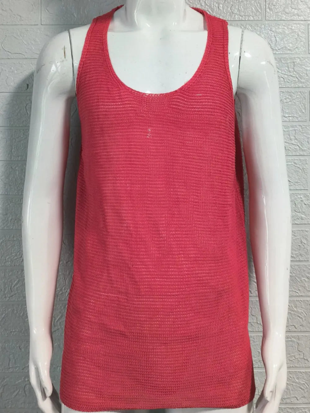 Open-knit scoop neck tank top in strawberry acrylic with a relaxed fit.