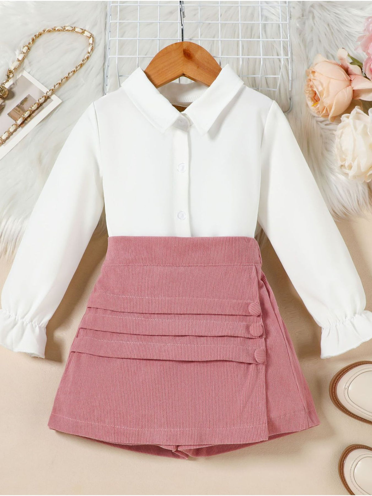 Toddler white flounce sleeve shirt and pink corduroy skort set with button detail