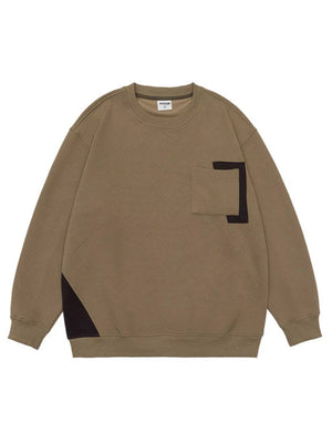 Khaki crew neck sweatshirt with geometric texture, chest pocket, and contrast panel detail.