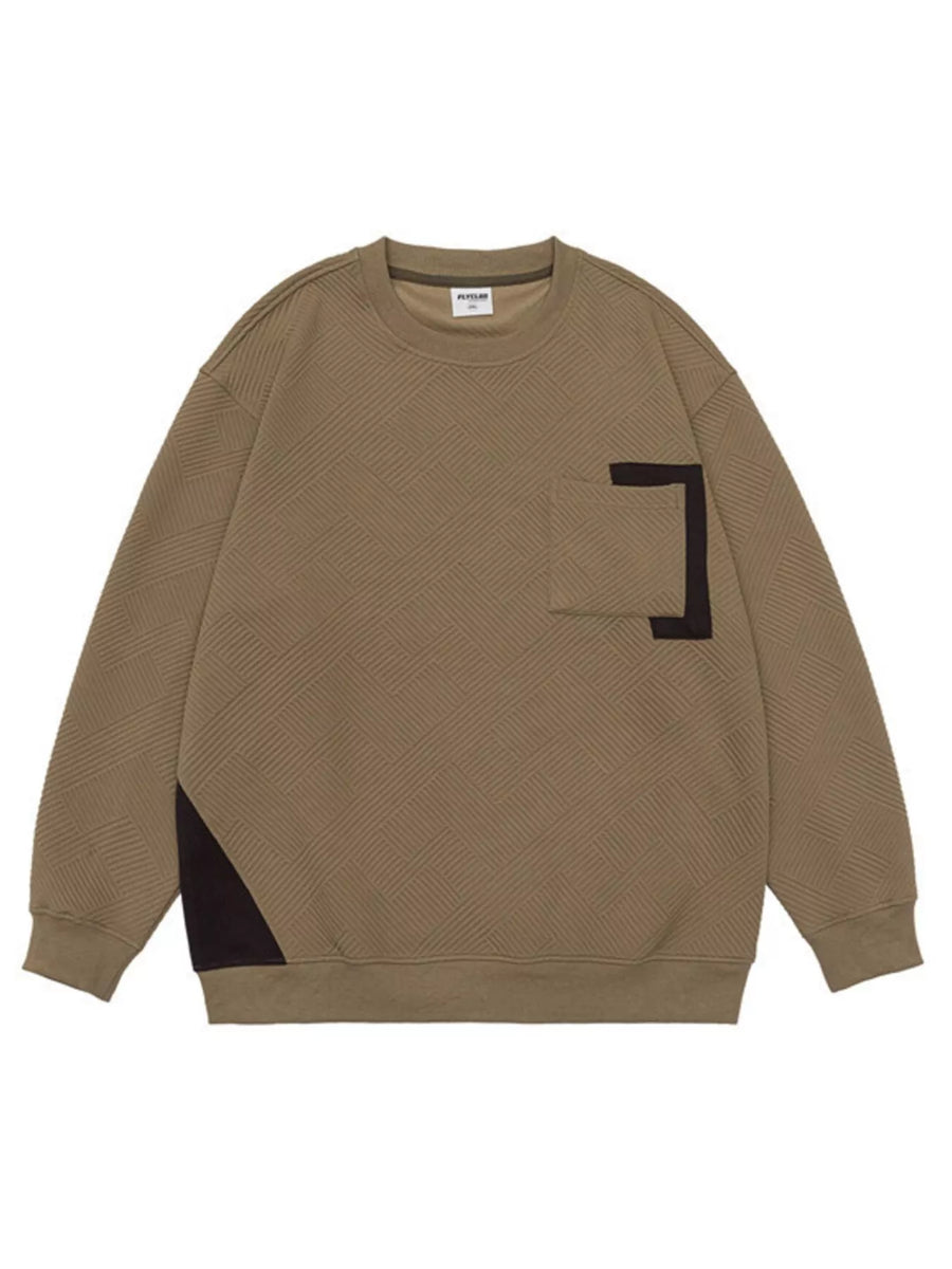 Khaki crew neck sweatshirt with geometric texture, chest pocket, and contrast panel detail.