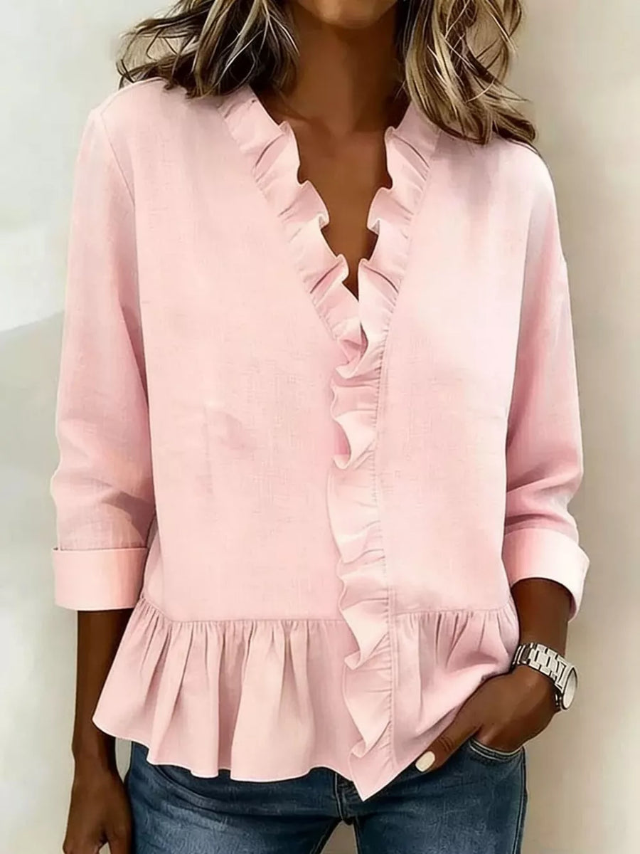 blouse in blush pink featuring ruffled and relaxed fit