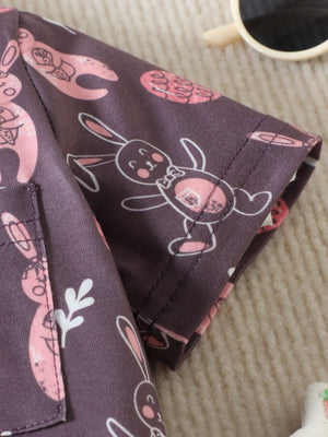 Baby short-sleeve shirt in plum with a pink bunny print, cotton fabric.