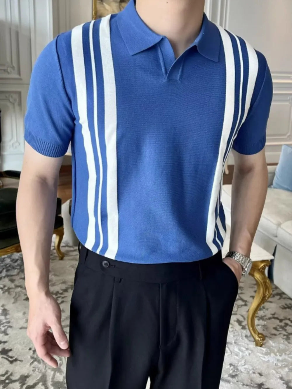 Blue knit polo shirt with white vertical stripes and short sleeves.