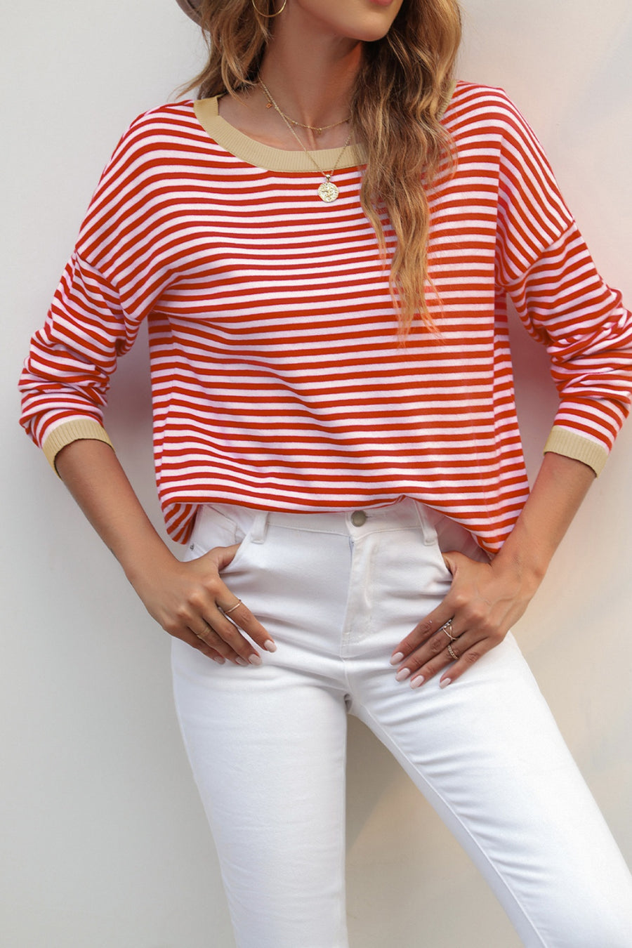 Nautical knit crewneck sweater with red and white stripes and contrast tan trim at neckline and cuffs.