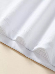 White cotton t-shirt hem detail with zig-zag stitching