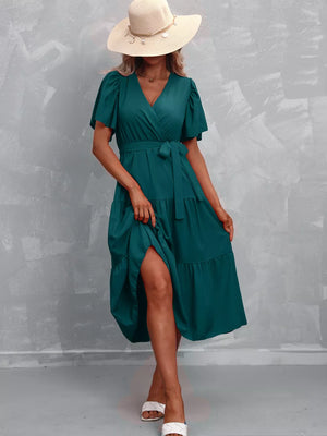 Dark Green tiered midi dress with flutter sleeves, V-neck, belted waist, and high slit.