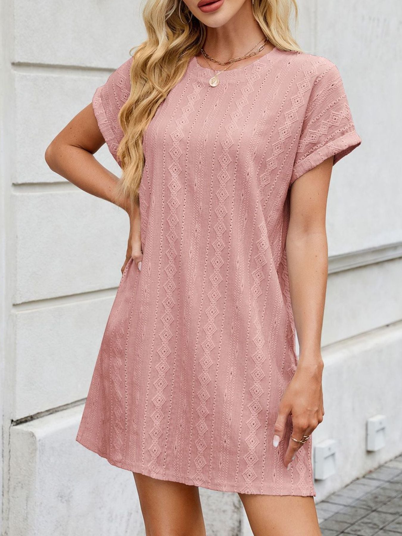 Dusty Pink eyelet mini dress with crew neck, short sleeves, and diamond pattern.