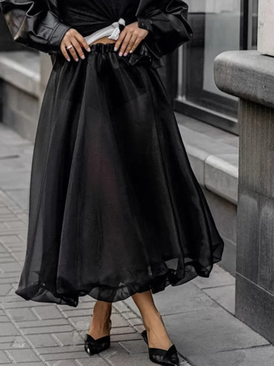 Black midi skirt with sheer overlay and ruffled hem, elastic waist, women's dressy casual style.