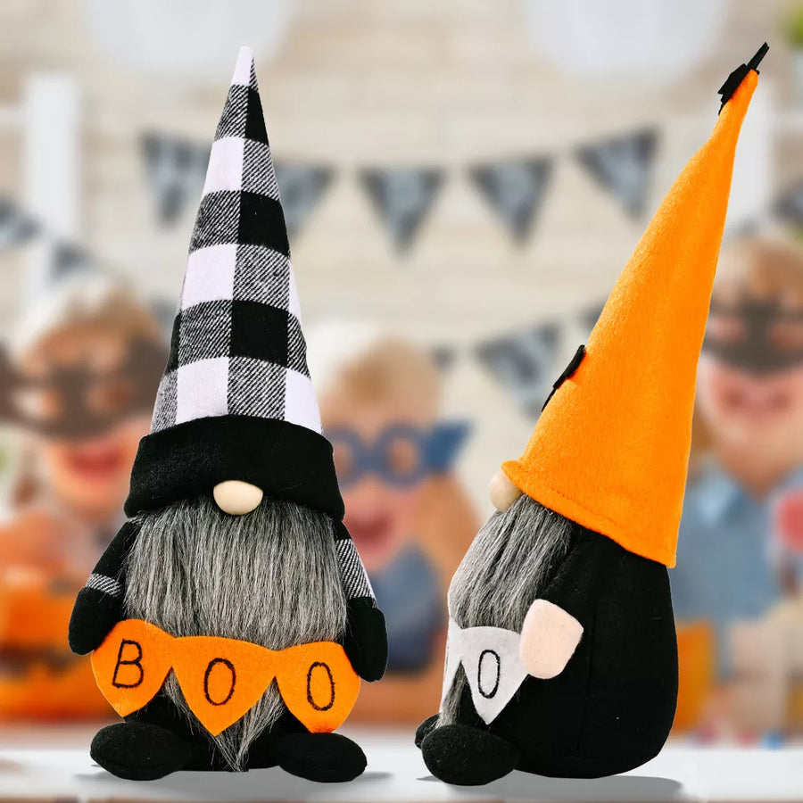 white decorative figurine featuring conical hat and plaid