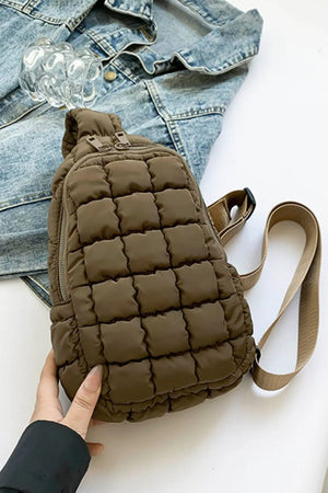 Padded sling bag in coffee brown with quilted pattern and top handle