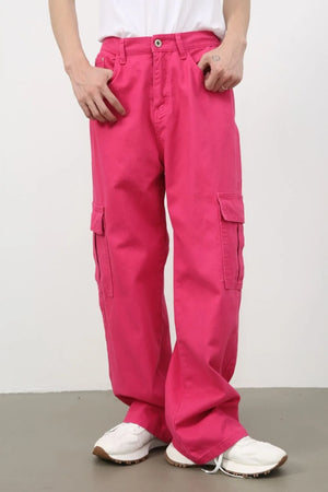 Electric pink baggy cargo pants with multiple pockets.