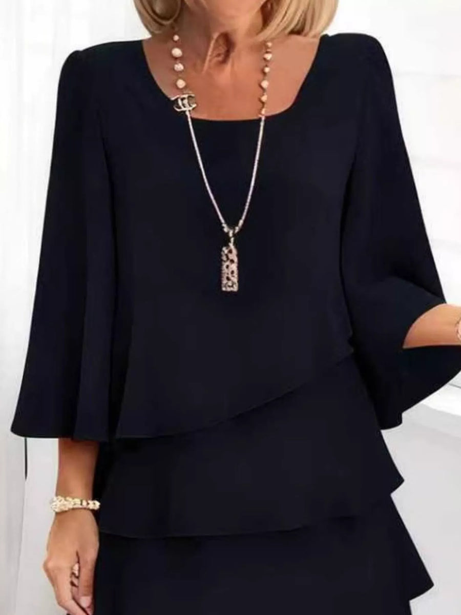 Black ruffled tiered dress with 3/4 bell sleeves and a square neckline.