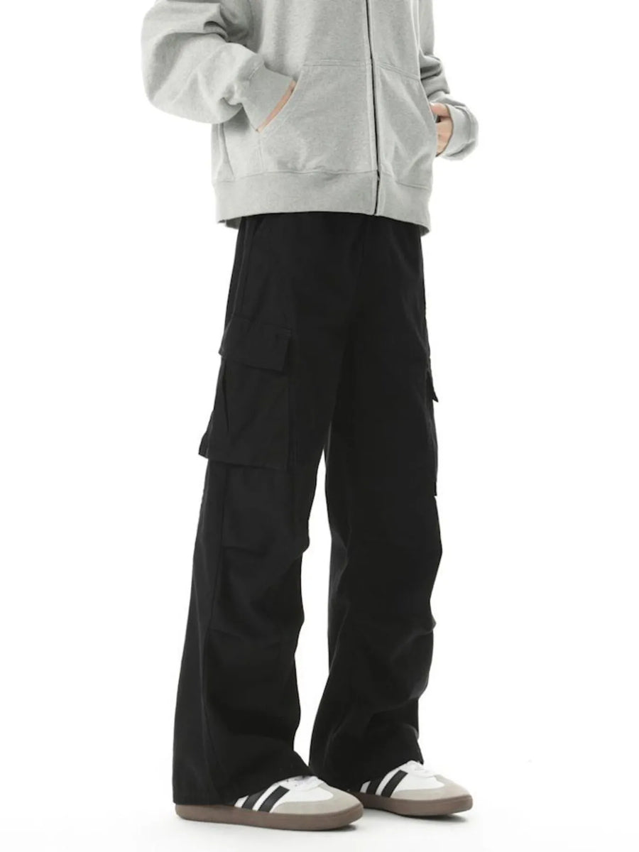 Relaxed fit black cargo pants with multiple utility pockets and a wide leg.