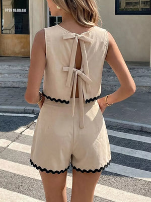 Scalloped trim tank and shorts set in beige with back tie closure and black scalloped trim.