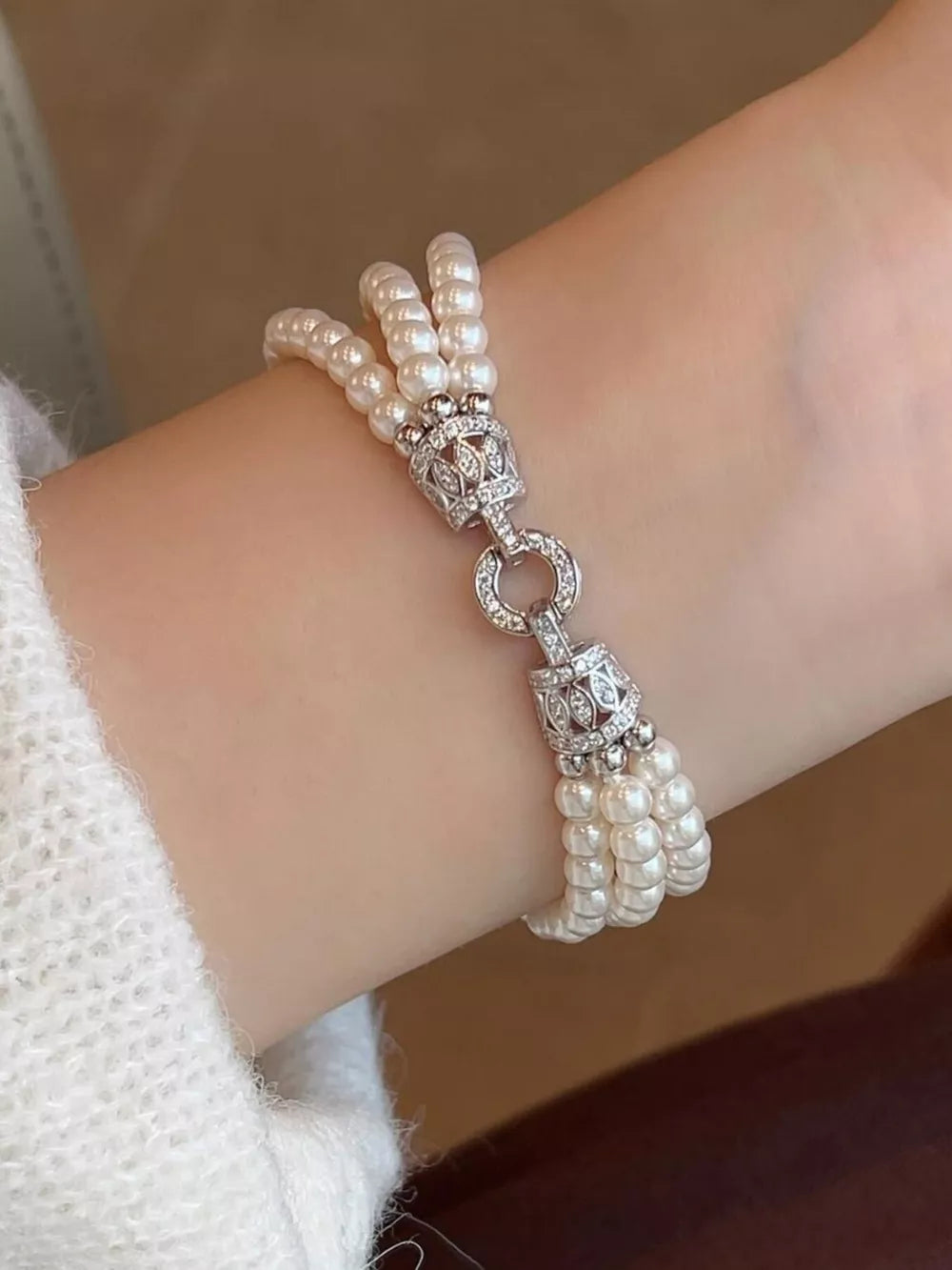 bracelet in ivory featuring three layers and layered fit