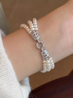 bracelet in ivory featuring three layers and layered fit