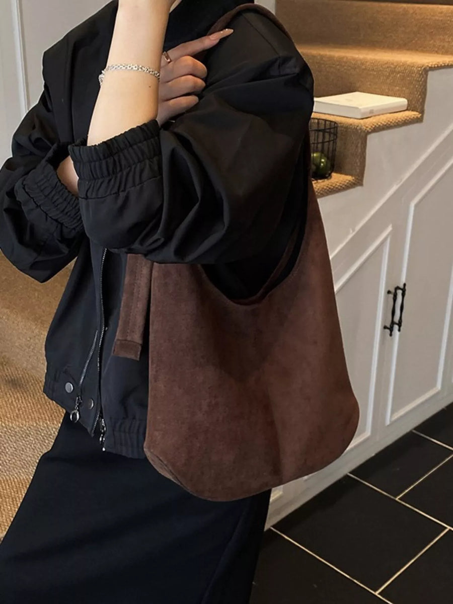 Large brown suede hobo shoulder bag with a slouchy silhouette and single strap.