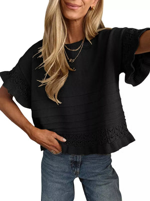 Black knit top with crew neck, short ruffled sleeves, and lace trim hem.