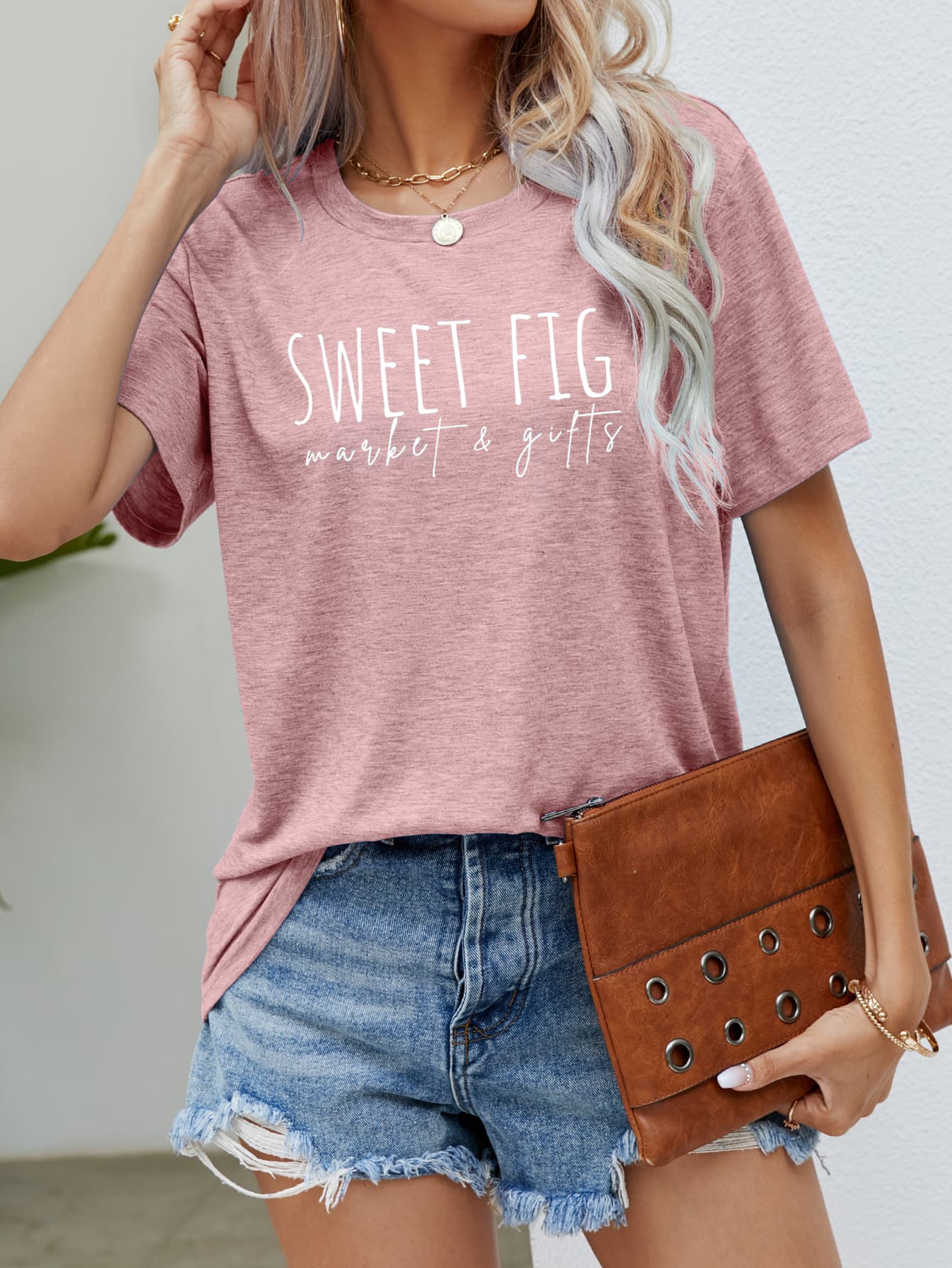 Blush pink graphic tee with white "Sweet Fig market & gifts" text, crew neck, short sleeves.