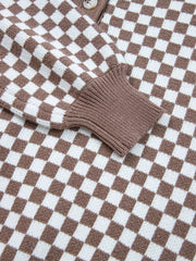 cream pullover sweater with half-button and checkerboard