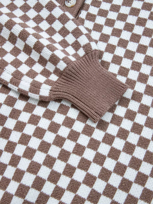 cream pullover sweater with half-button and checkerboard