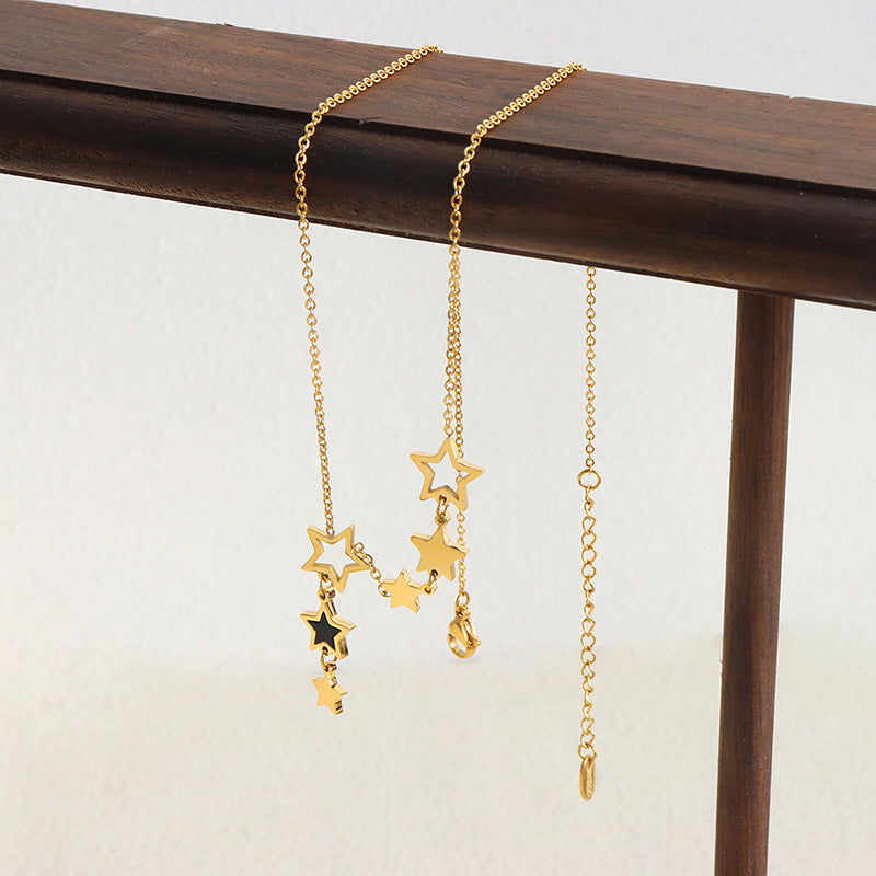 Gold celestial star necklace with adjustable chain and clasp.