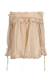 Champagne off-shoulder ruffled maternity blouse with adjustable tie details.