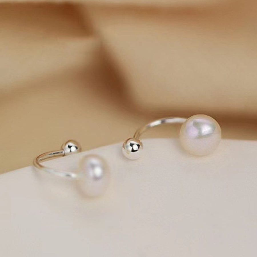 Sterling pearl stud earrings with silver finish and double bead detail.