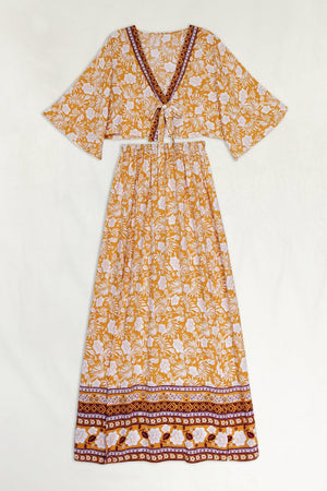 Bohemian floral crop top and maxi skirt set in tangerine with tie front and border print.
