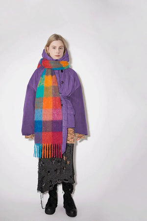 Checked plaid fringed winter wrap scarf in multicolor grid pattern with fringe detail.