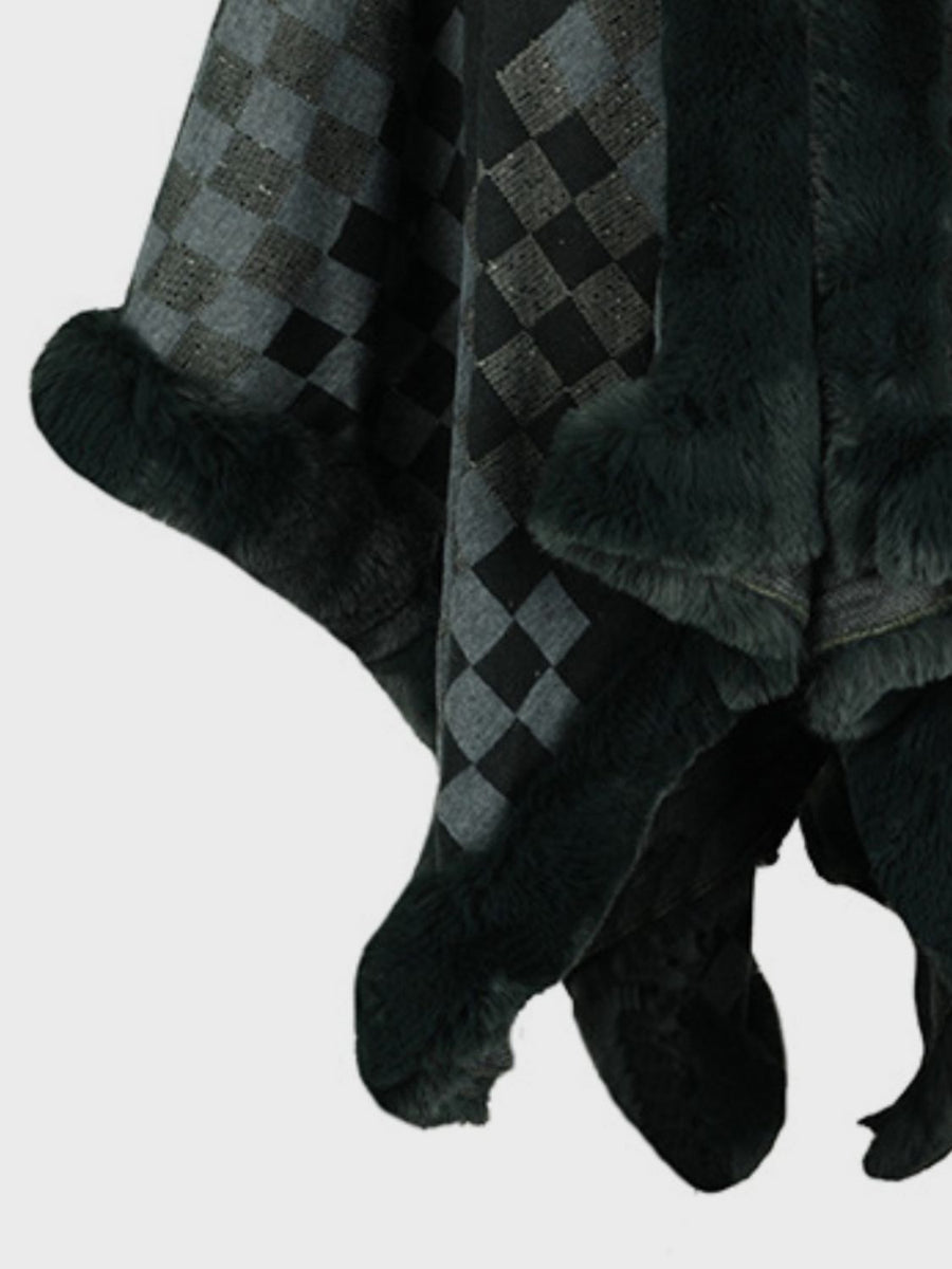 Checkered cape in black and grey with faux fur trim.