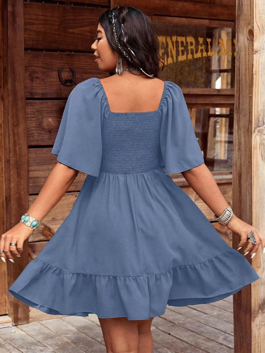 Blue smocked square neck flutter sleeve mini dress with ruffled hem