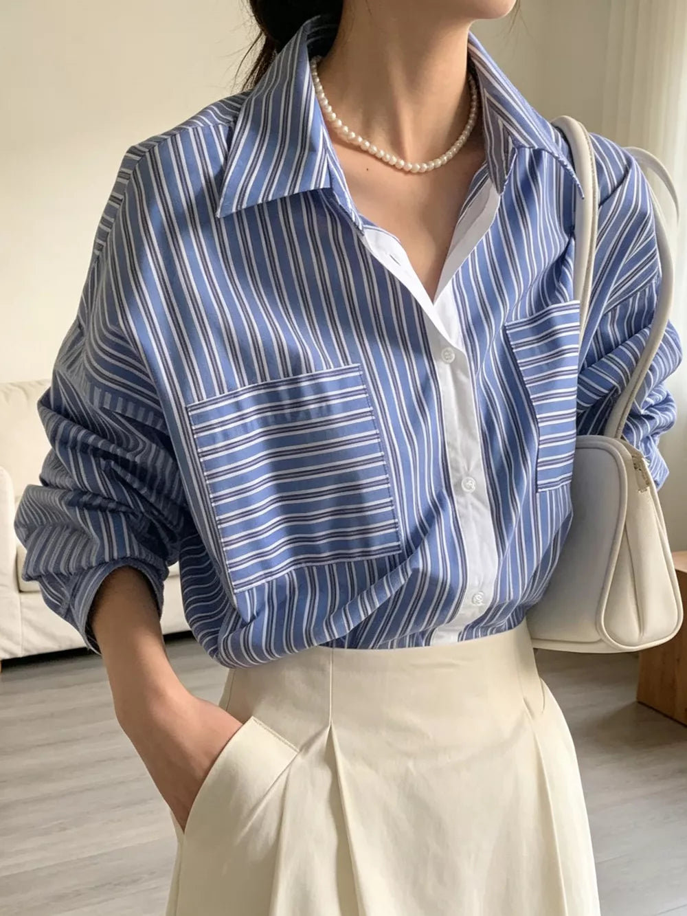 100% polyester Care instructions: Machine wash cold button-down shirt in Blue with relaxed silhouette