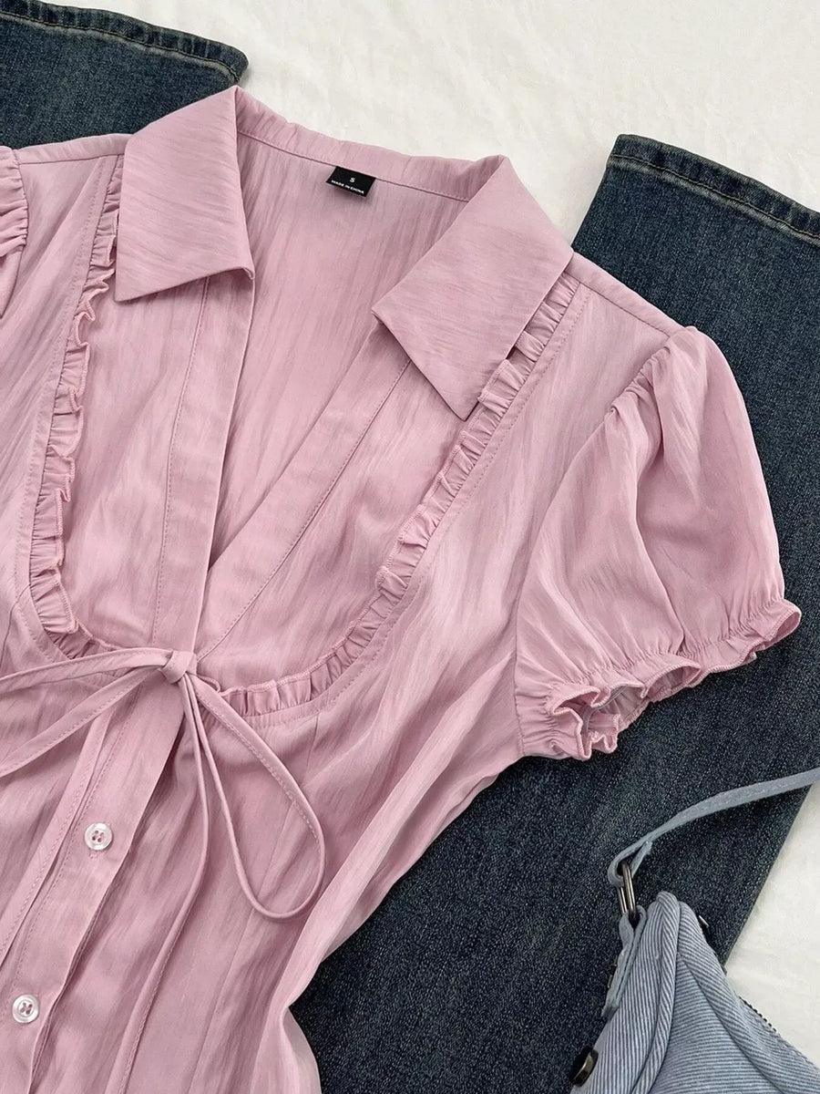 Pink button-up shirt with hip-length and button-front