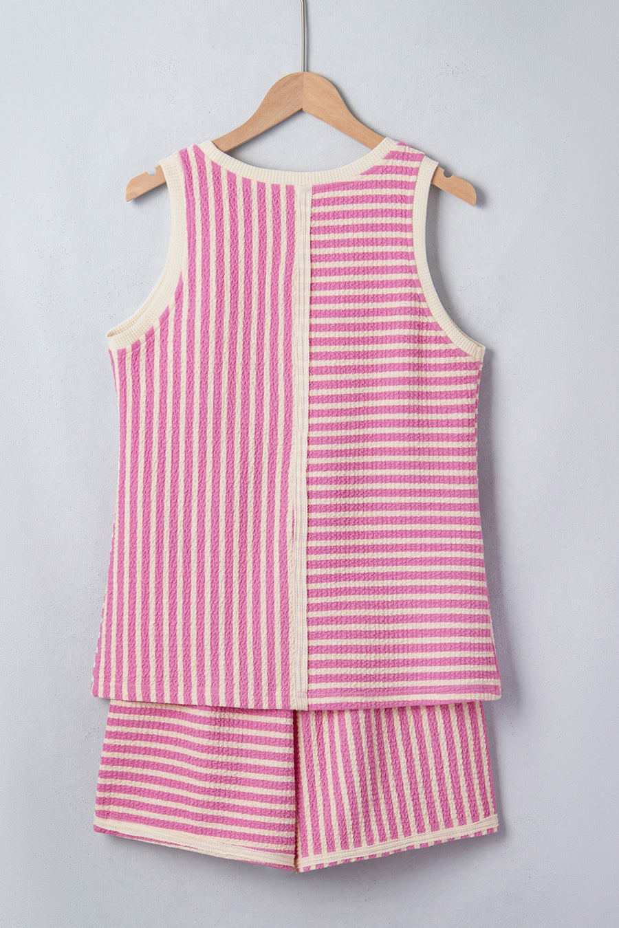 Textured stripe two-piece set with pink and cream vertical and horizontal stripes.