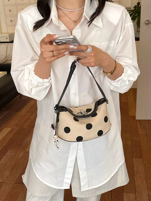 Polka Dot Shoulder Bag in black with flap closure